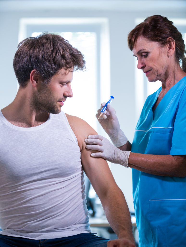 A patient working with a physical therapist on neck stretches following a trigger point injection.