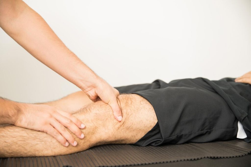 Provider examining knee for arthrocentesis benefits