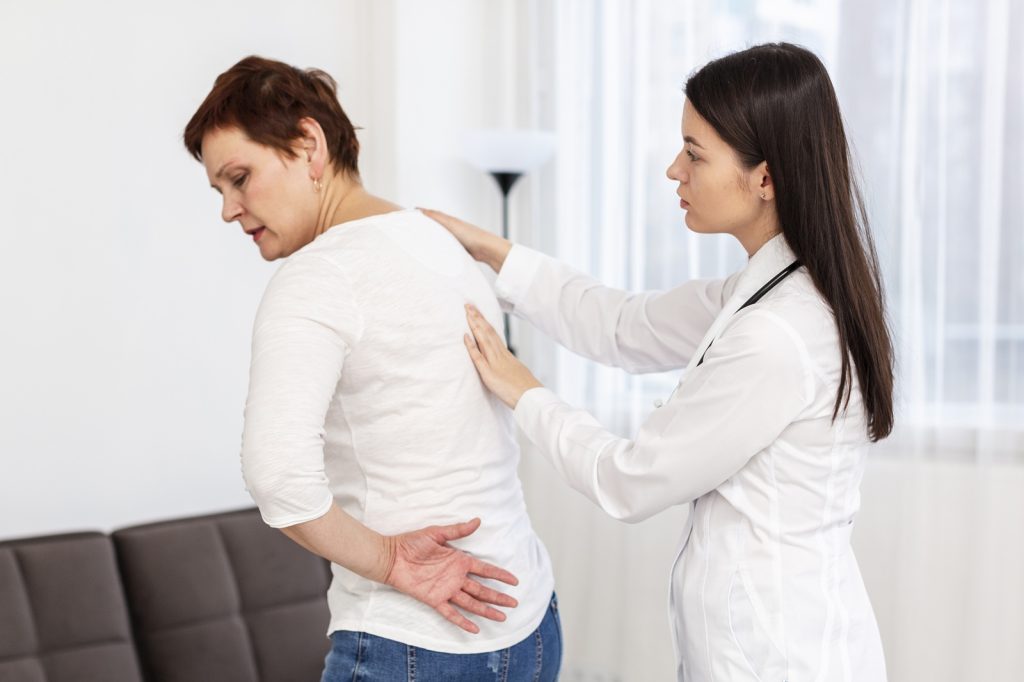 Shoulder specialist reviewing treatment options with patient