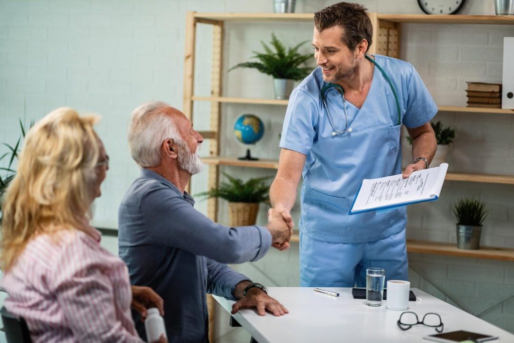Medical provider reviewing a joint image with a patient from Mint Hill NC