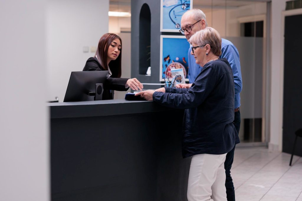 Patients checking in at the Joint Health Solutions clinic reception in Charlotte NC