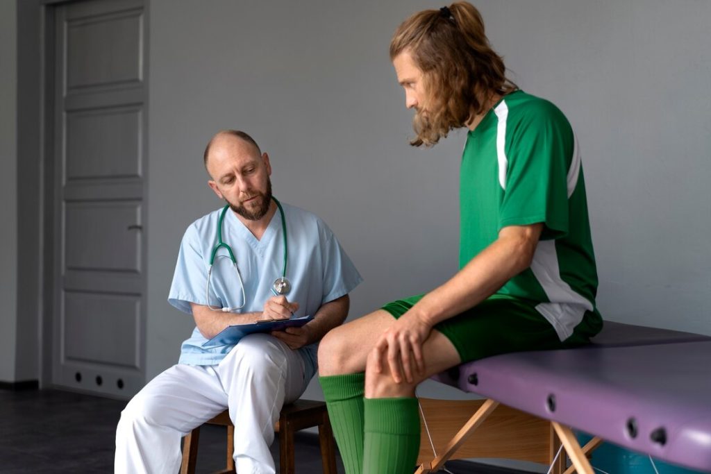 Healthcare professional supporting a patient during non-surgical knee care