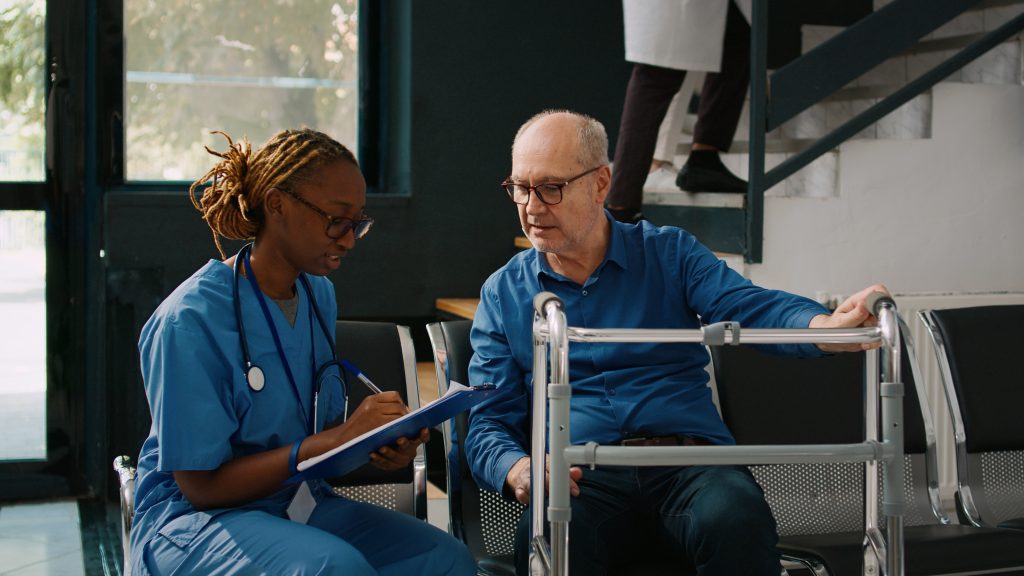 Healthcare professional supporting a patient during non-surgical knee care