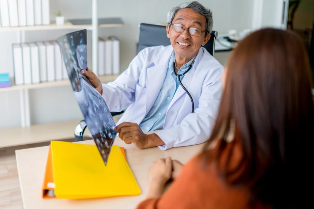 Medical provider reviewing a joint image with a patient during a consultation in Charlotte NC