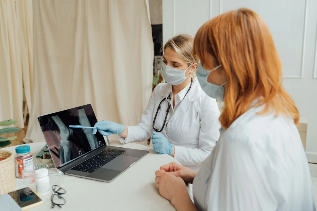 Medical provider reviewing a joint image with a patient from Fort Mill SC