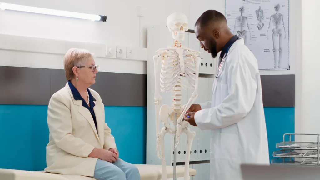Medical provider examining a patient during non-surgical joint care near Concord NC
