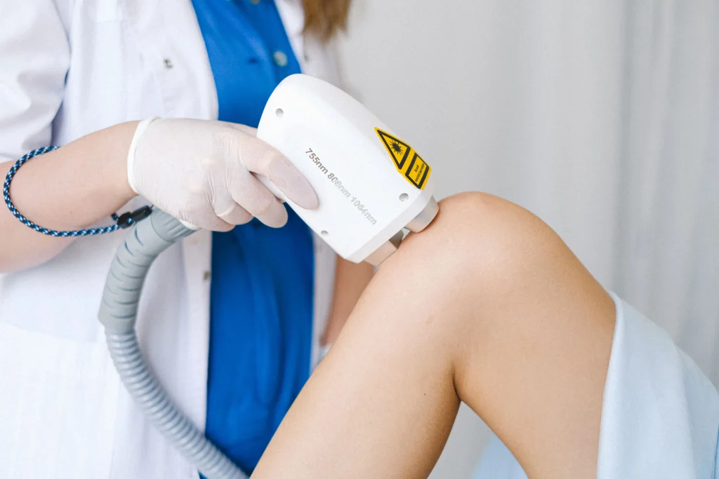 Healthcare professional supporting a patient during non-surgical knee care