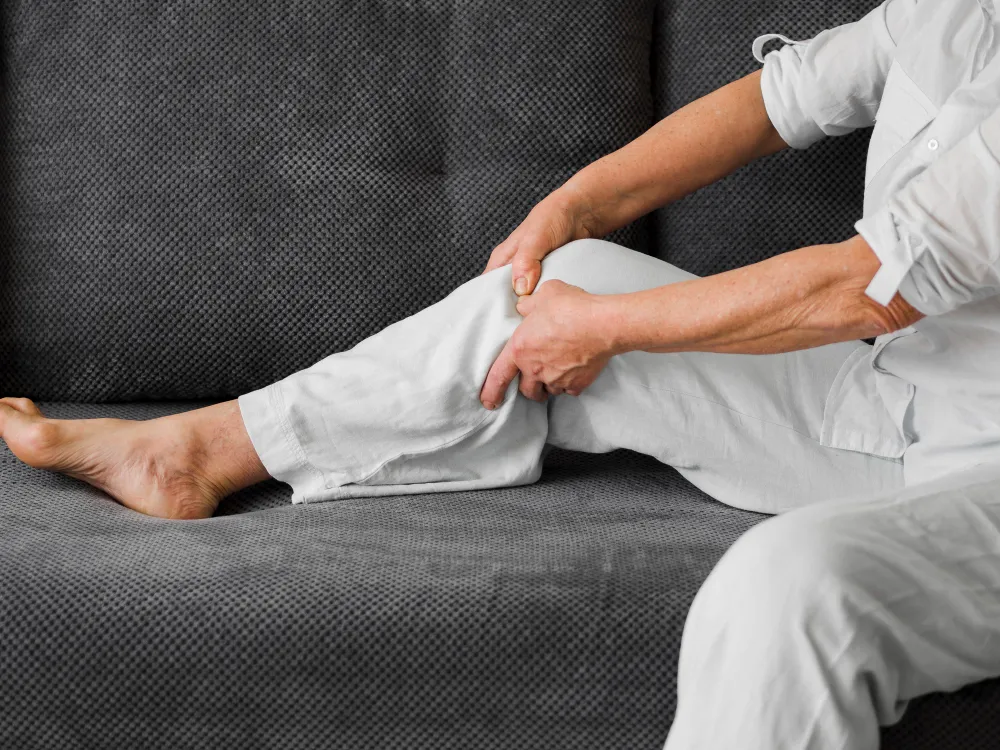Healthcare professional supporting a patient during non-surgical knee care